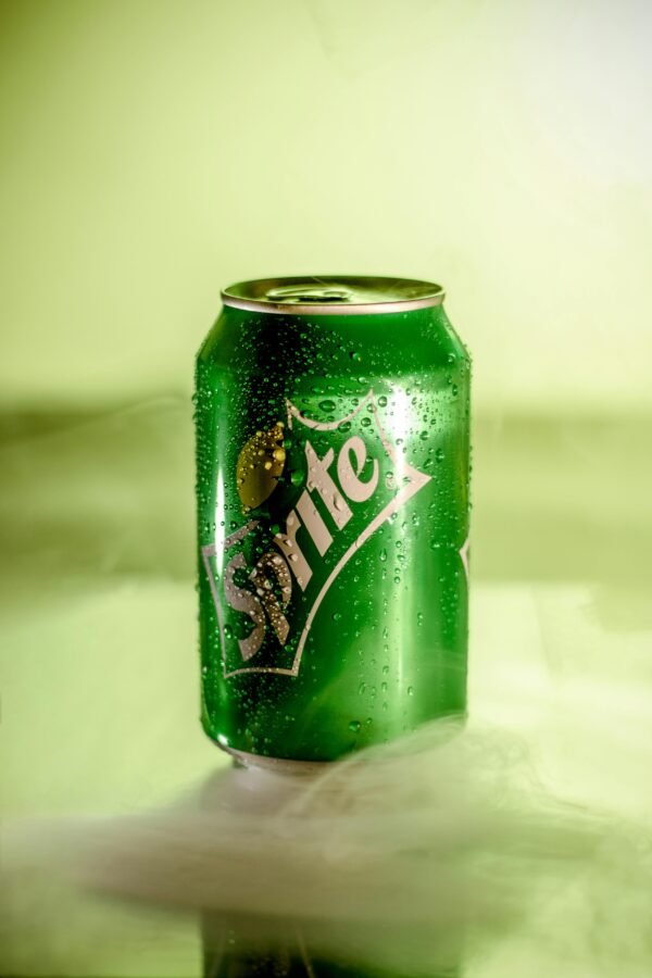 Shot of a Sprite can with mist effect showcasing refreshing qualities.